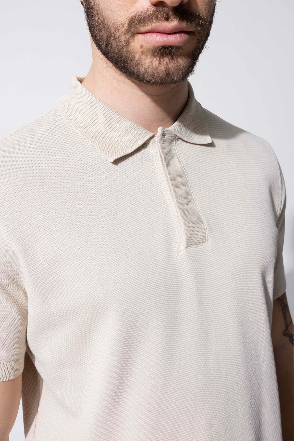 COVERED BUTTON POLO