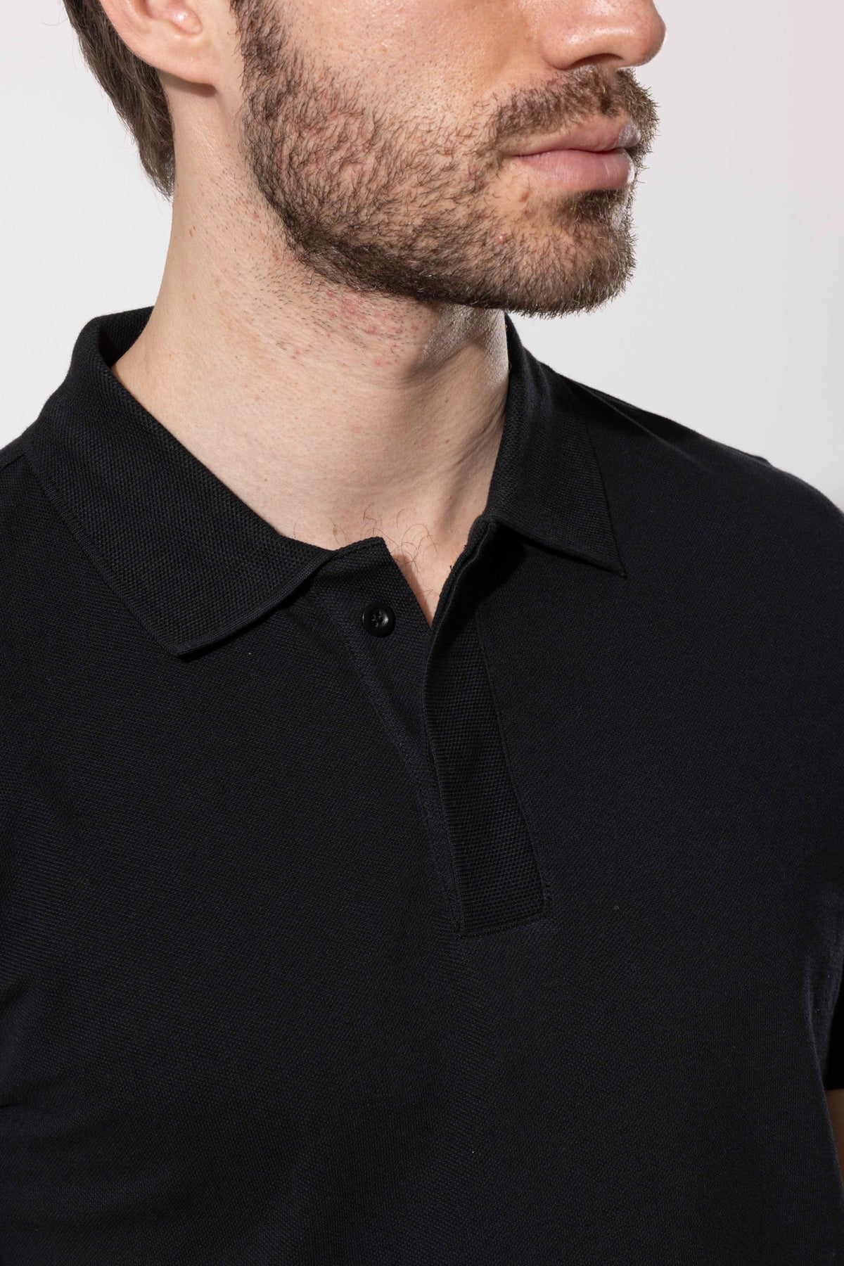 COVERED BUTTON POLO