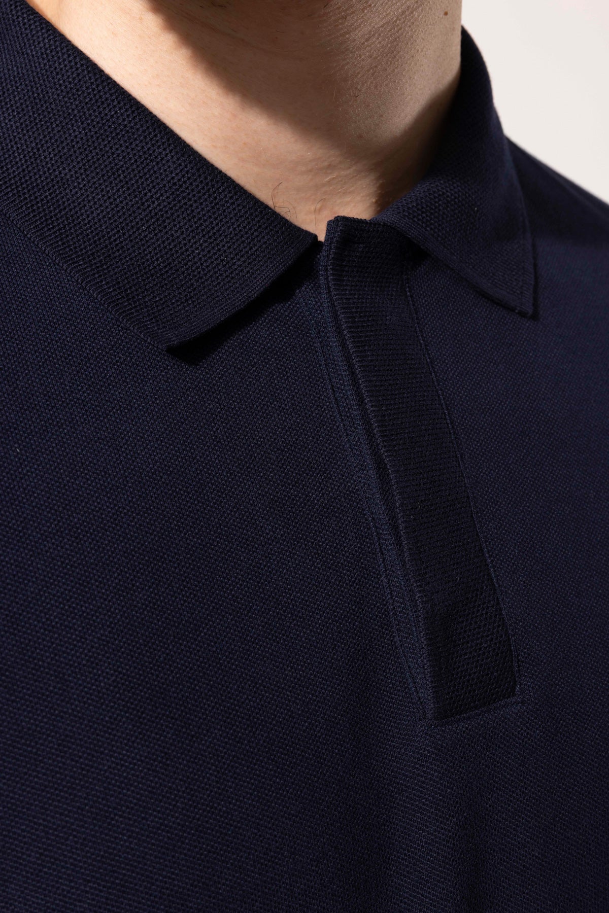 COVERED BUTTON POLO